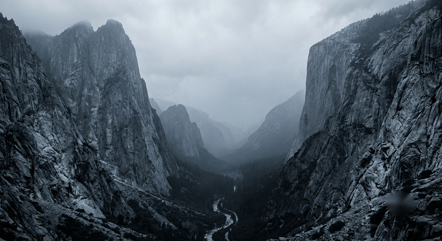 A granite valley under low cloud, a river running through the floor